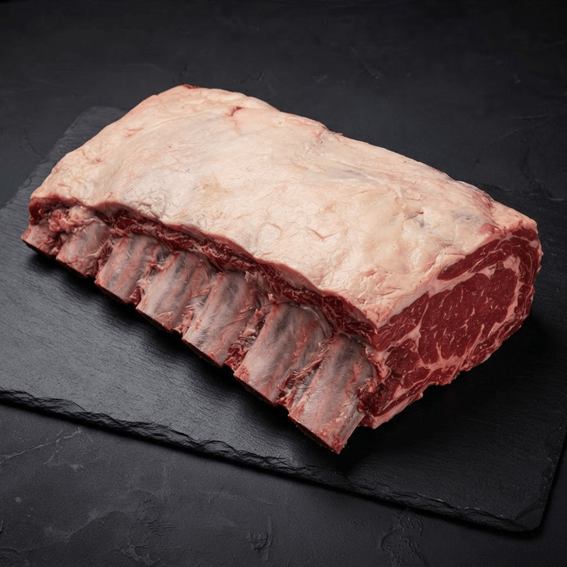 Premium halal Black Angus Cote de Boeuf on dark slate